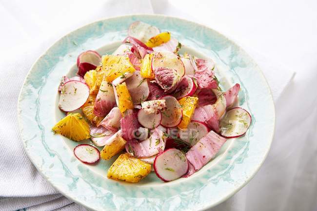 Closeup view of radish salad with oranges and radicchio — Stock Photo