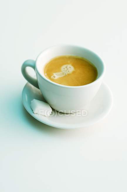 Cup of espresso with sugar — Stock Photo
