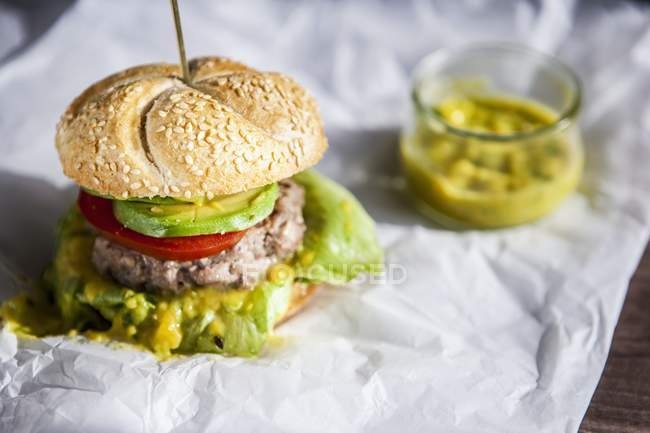 Hamburgers with avocado and mango cream — Stock Photo