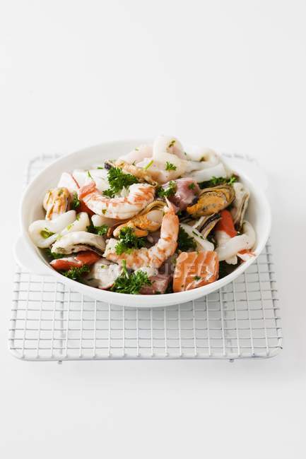 Mixed seafood with fish and parsley — Stock Photo