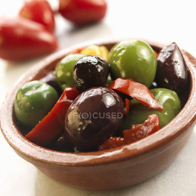 Marinated olives and peppers — Stock Photo