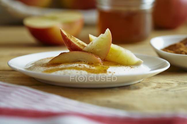 Yogurt with apple and cinnamon — Stock Photo