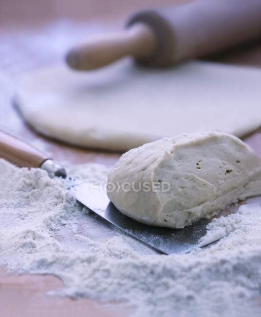 Yeast dough over table — Stock Photo