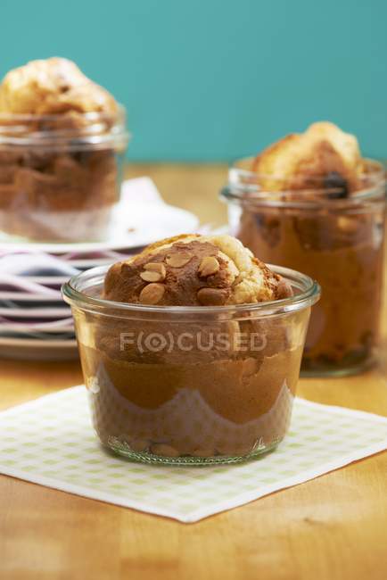 Peanut muffins in glass jars — Stock Photo