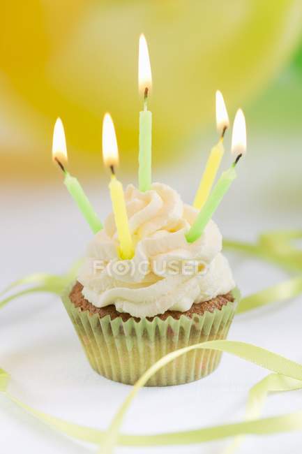 Cupcake with birthday candles — Stock Photo
