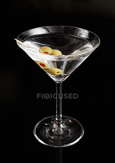 Martini with green olives — Stock Photo