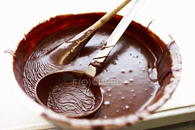 Chocolate icing in bowl — Stock Photo
