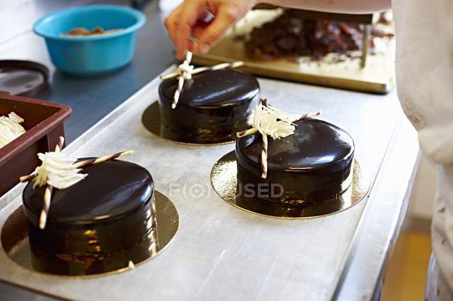 Festive cakes with dark chocolate glaze — Stock Photo