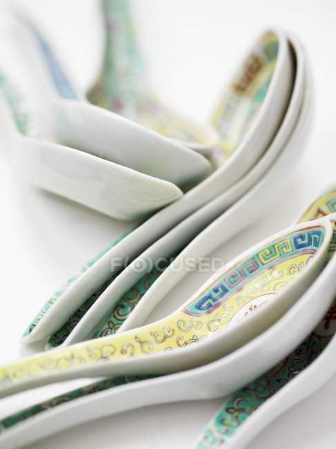 Closeup view of Chinese patterned spoons — Stock Photo