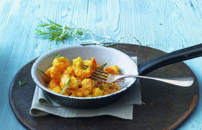 Prawns with curry and rosemary — Stock Photo