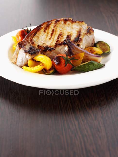 Grilled pork chop with roasted vegetables — Stock Photo