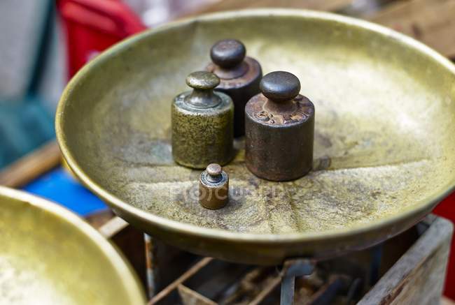 Closeup view of weights on a weighing dish — Stock Photo