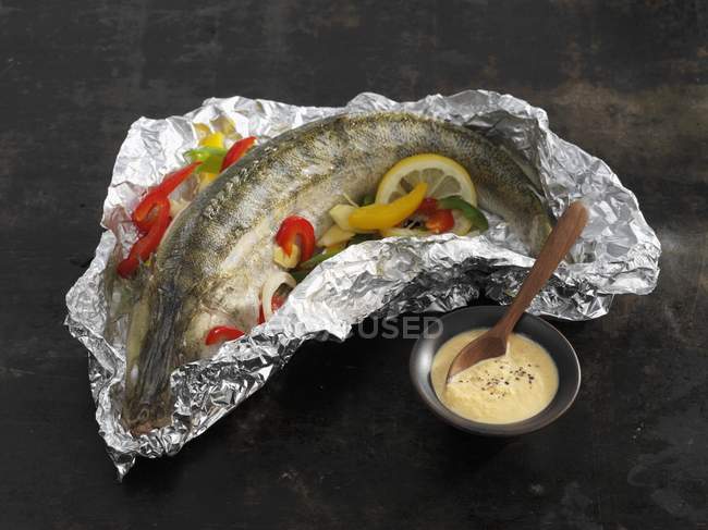 Elevated view of stuffed Zander fish with a Schmand dip — Stock Photo