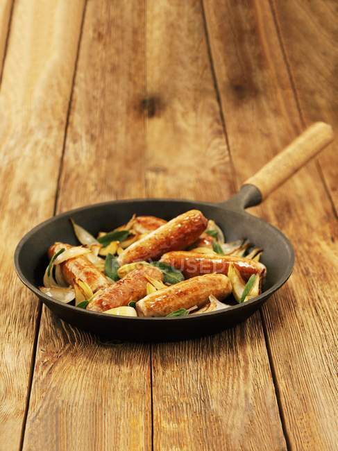 Sausages with sage and onions — Stock Photo