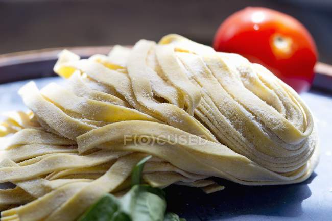 Fresh tagliatelle pasta — Stock Photo