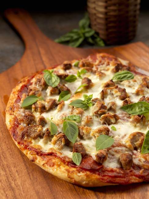 Rustic pizza with sausages — Stock Photo