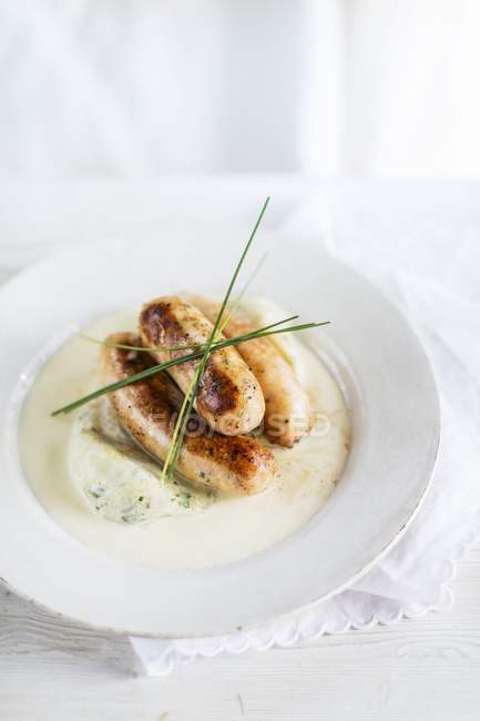 Salmon sausages with mashed potatoes — Stock Photo