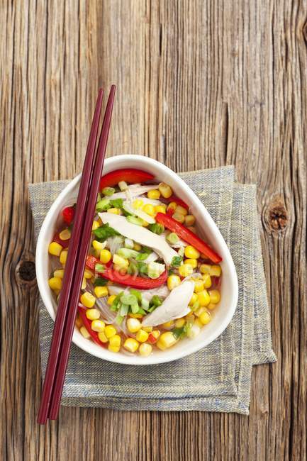 Chicken soup with sweetcorn, pasta and  pepper — Stock Photo