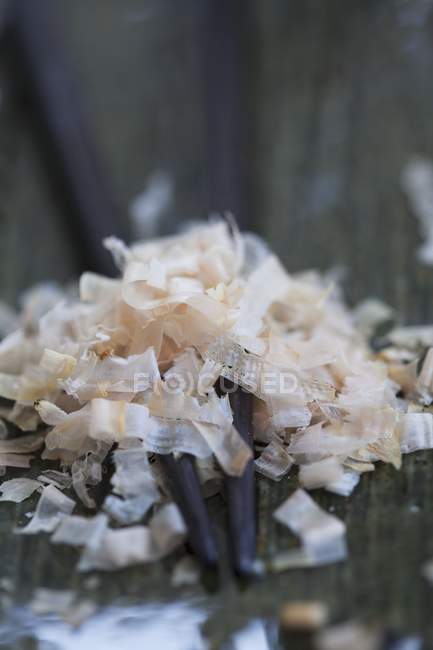 Closeup view of dried bonito flakes on chopsticks — Stock Photo
