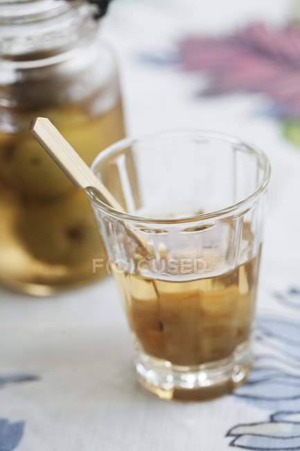 Closeup view of a Japanese apricot in liqueur — Stock Photo
