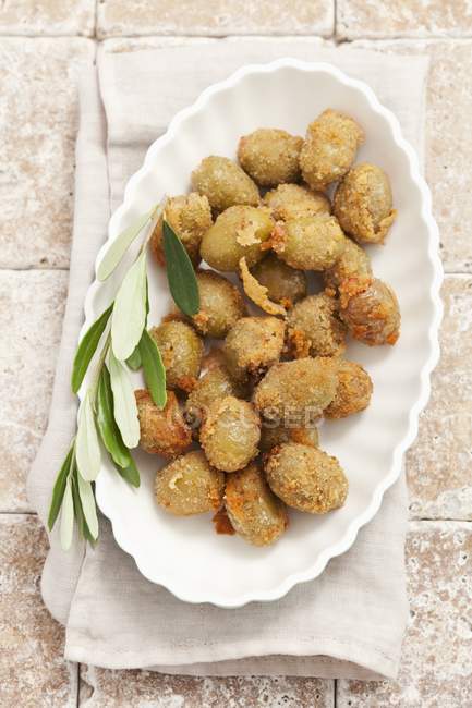Breaded fried olives filled with anchovies — Stock Photo