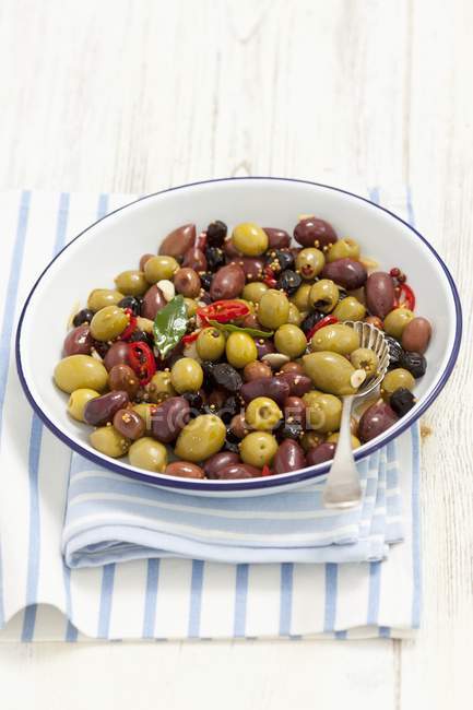 Mixed marinated olives with garlic — Stock Photo