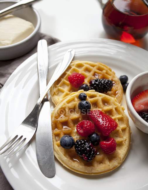 Waffles with butter and maple syrup — Stock Photo