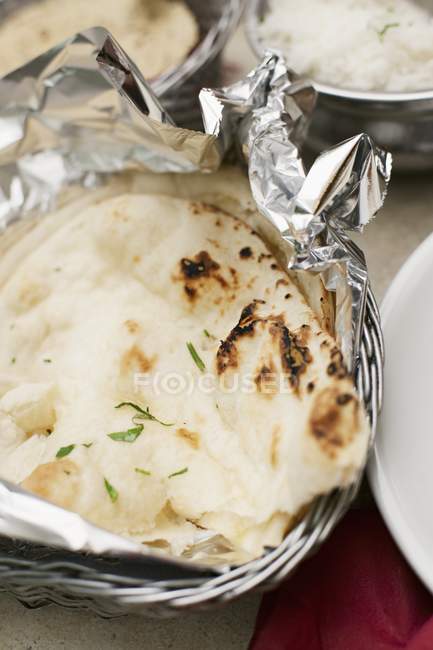 Naan bread in foil — Stock Photo