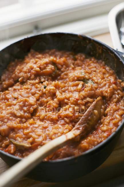 Tomato risotto rice in pan — Stock Photo