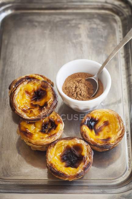 Portuguese egg tart pastry and cinnamon — Stock Photo