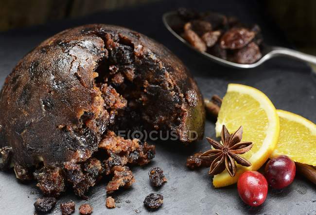 Christmas pudding with cranberries and oranges — Stock Photo
