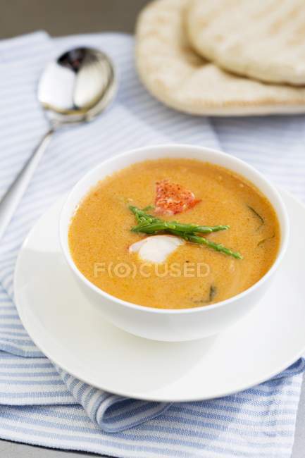 Closeup view of lobster soup with herb — Stock Photo