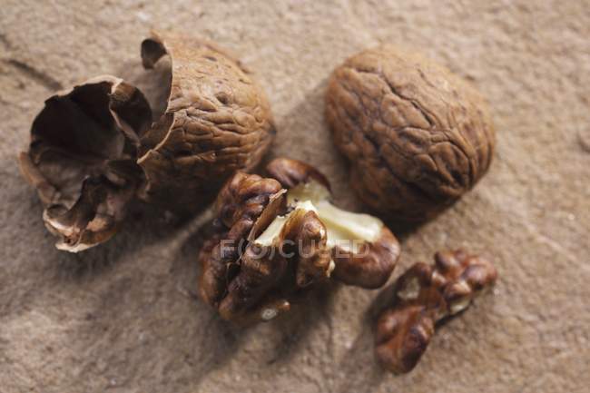 Cracked raw walnuts — Stock Photo