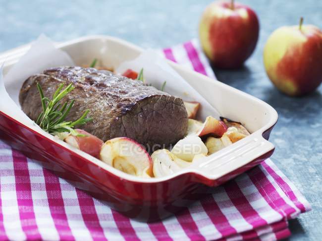 Roasted beef with apple and rosemary — Stock Photo