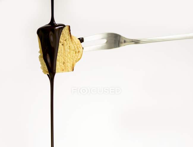 Chocolate poured over layer cake — Stock Photo