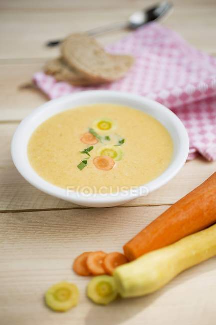 Carrot and ginger soup in white bowl — Stock Photo