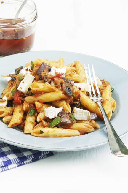 Penne pasta with aubergine and cheese — Stock Photo