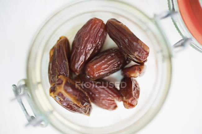 Dried dates in jar — Stock Photo