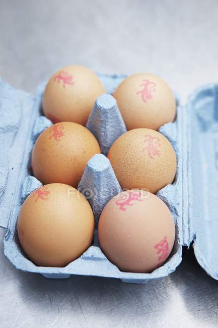 Brown eggs with stamps — Stock Photo