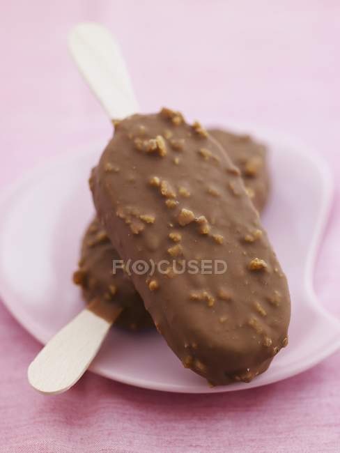 Chocolate covered ice cream sticks — Stock Photo