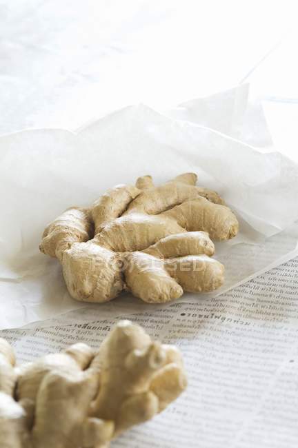 Fresh ginger root in paper — Stock Photo