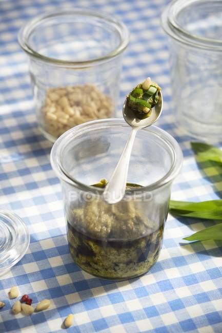 Closeup view of chive Pesto with pine nuts — Stock Photo
