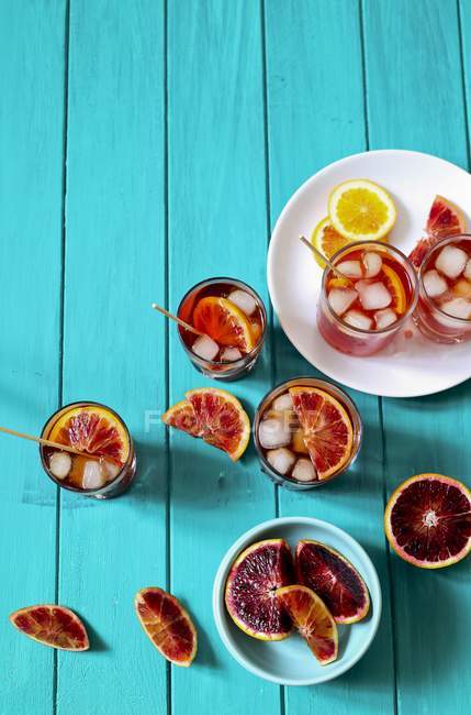Elevated view of iced Spritz veneziano with blood oranges and lemon — Stock Photo