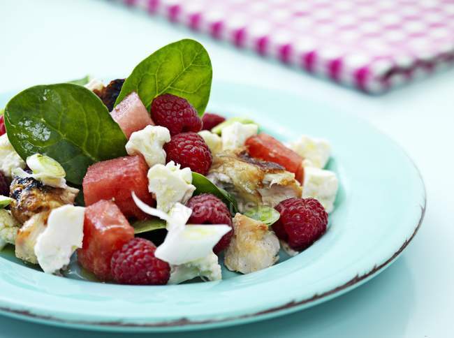 Meat salad with watermelon, raspberries and cheese — Stock Photo
