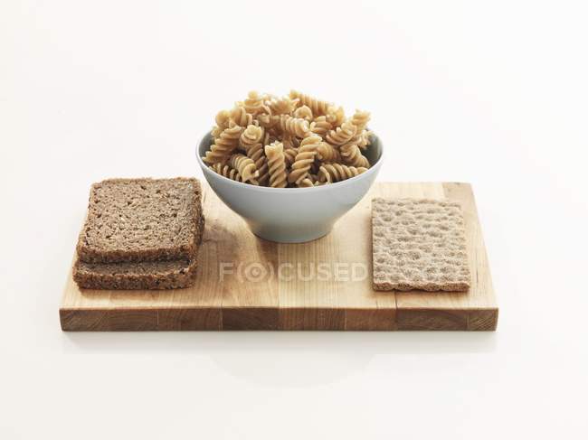 Wholemeal toasts, pasta and crispbread — Stock Photo