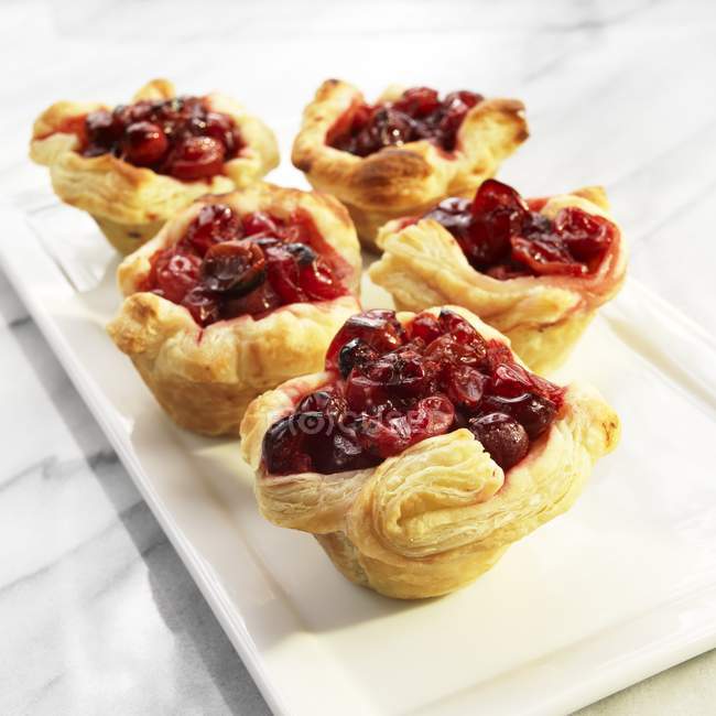 Puff pastry cranberry tartlets — Stock Photo