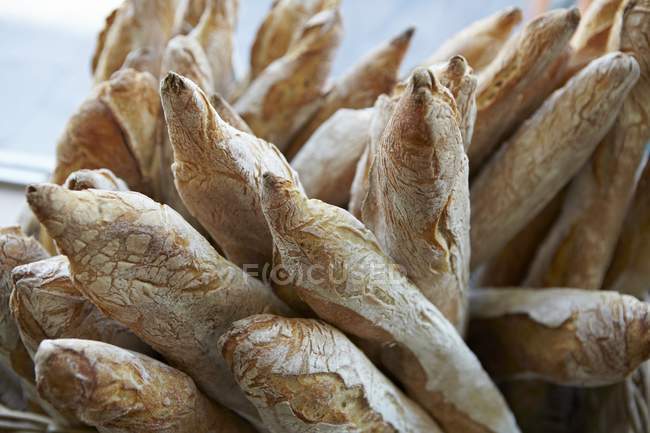 Freshly baked Baguettes in basket — Stock Photo
