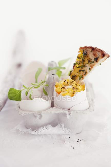 Closeup view of eggs and soldiers with herbs for breakfast — Stock Photo