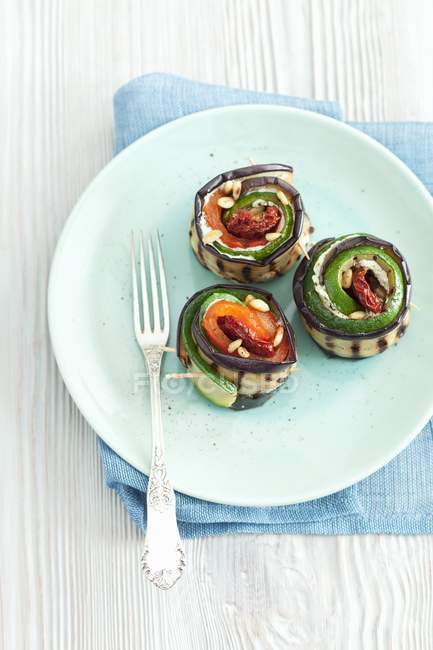 Courgettes and aubergine roles — Stock Photo