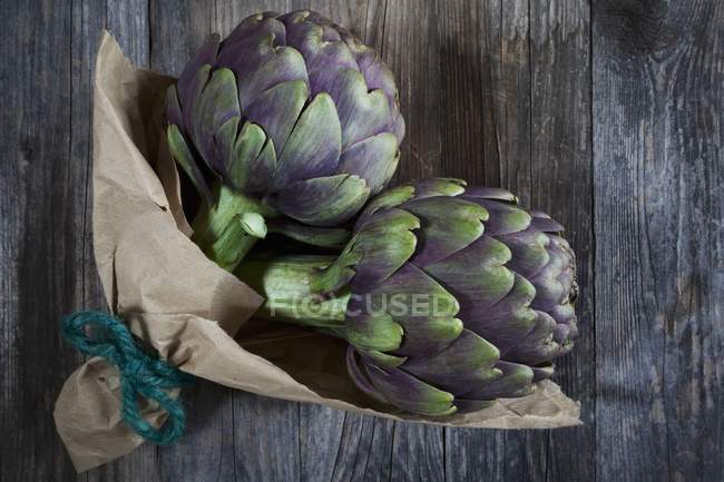Artichokes wrapped in parchment — Stock Photo